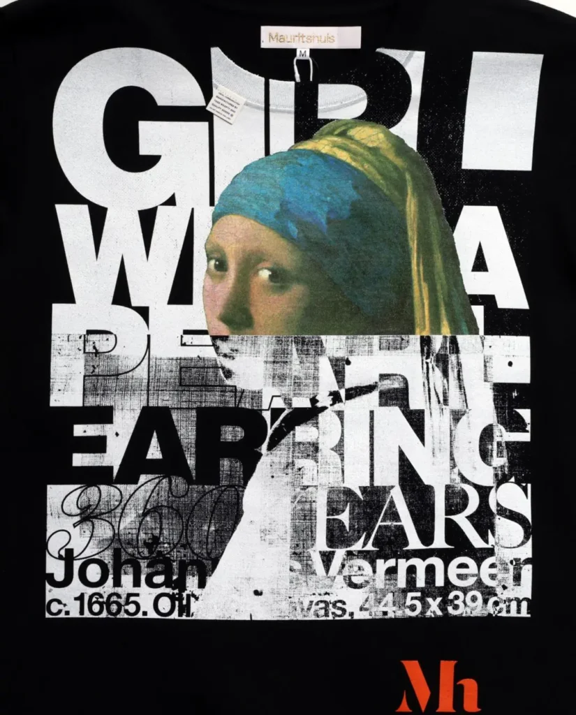 Close-up of the black graphic print highlight Vermeer's Girl with a Pearl Earring layer with oversize text, distress graphics, and museum-inspire typography