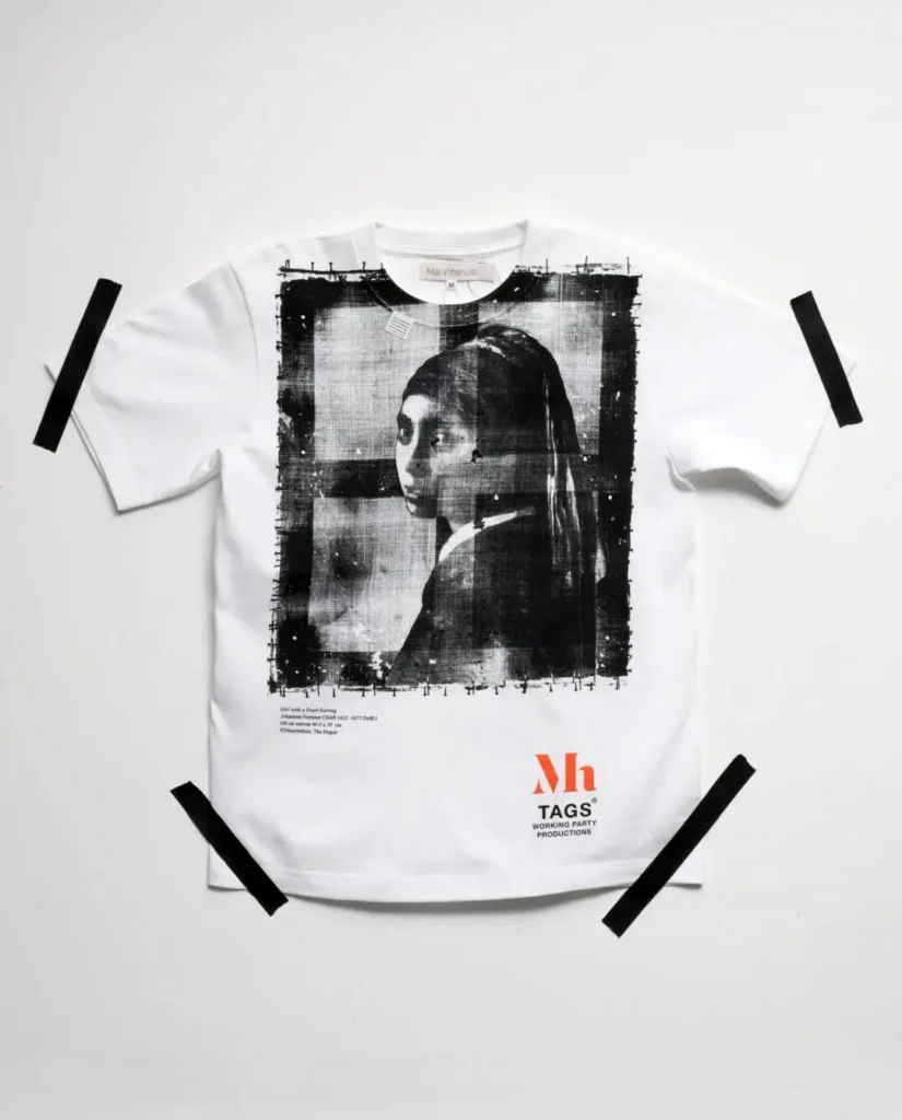 White Tee show a distressed black-and-white print of Vermeer's Girl with a Pearl Earring with subtle museum caption details beneath