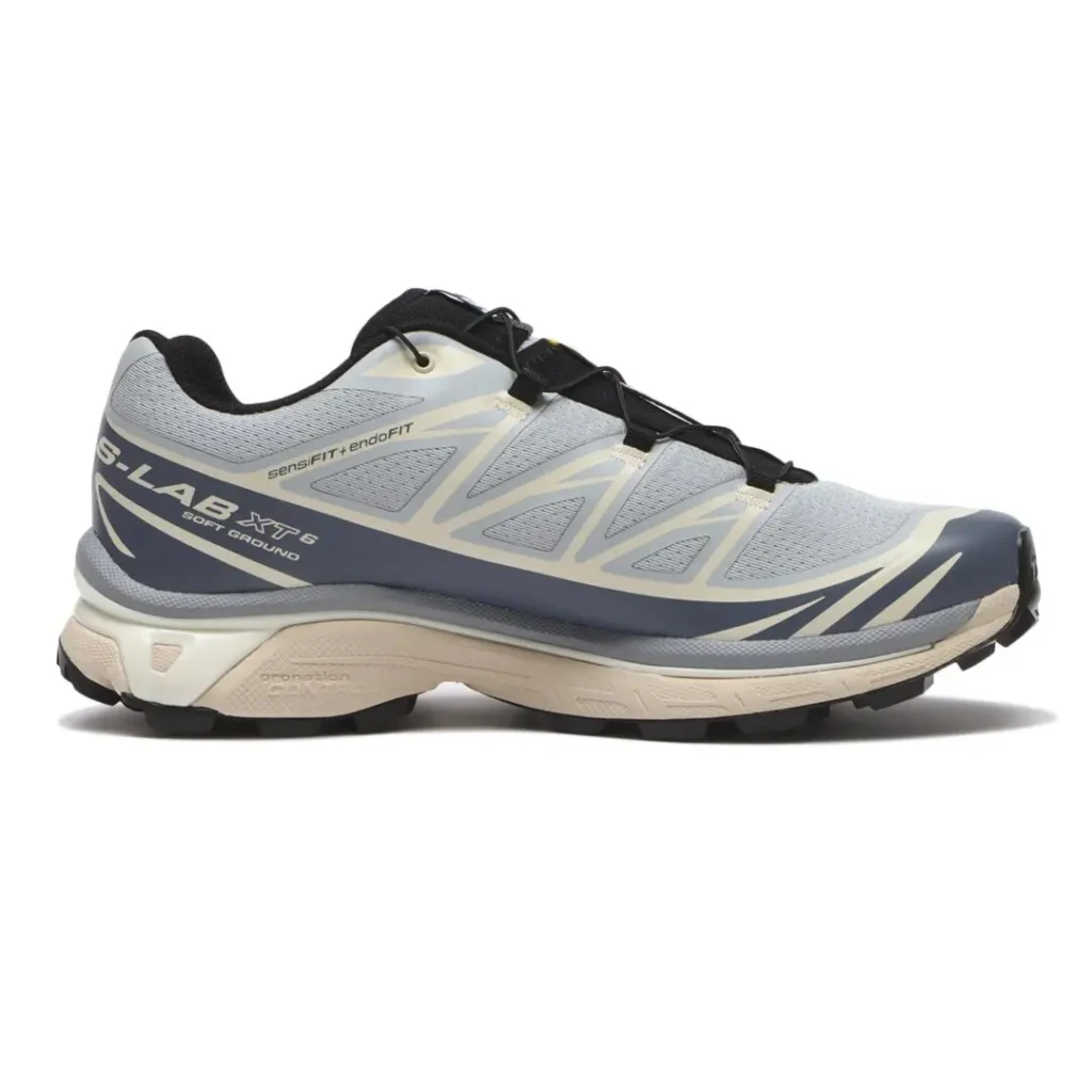 Medial Side Profile Of Salomon XT-6 Showing Gray Mesh, Cream Overlays And Black Tread