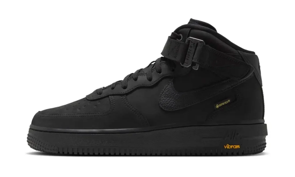 Side profile of a black Nike Air Force 1 Mid feature a texture Swoosh, GORE-TEX brand and Vibram sole