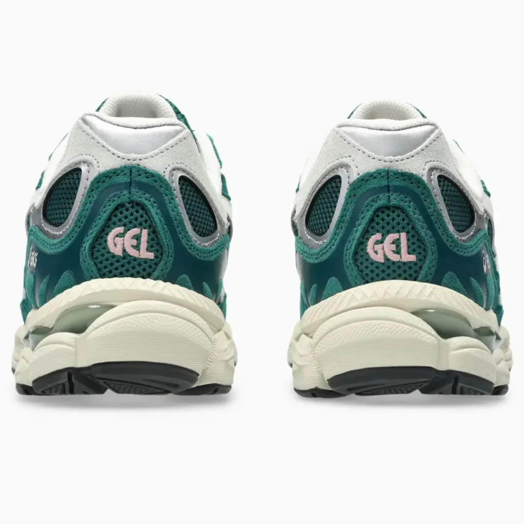 Rear view of green and white mesh sneakers with pink GEL logos and chunky cream soles on a white background