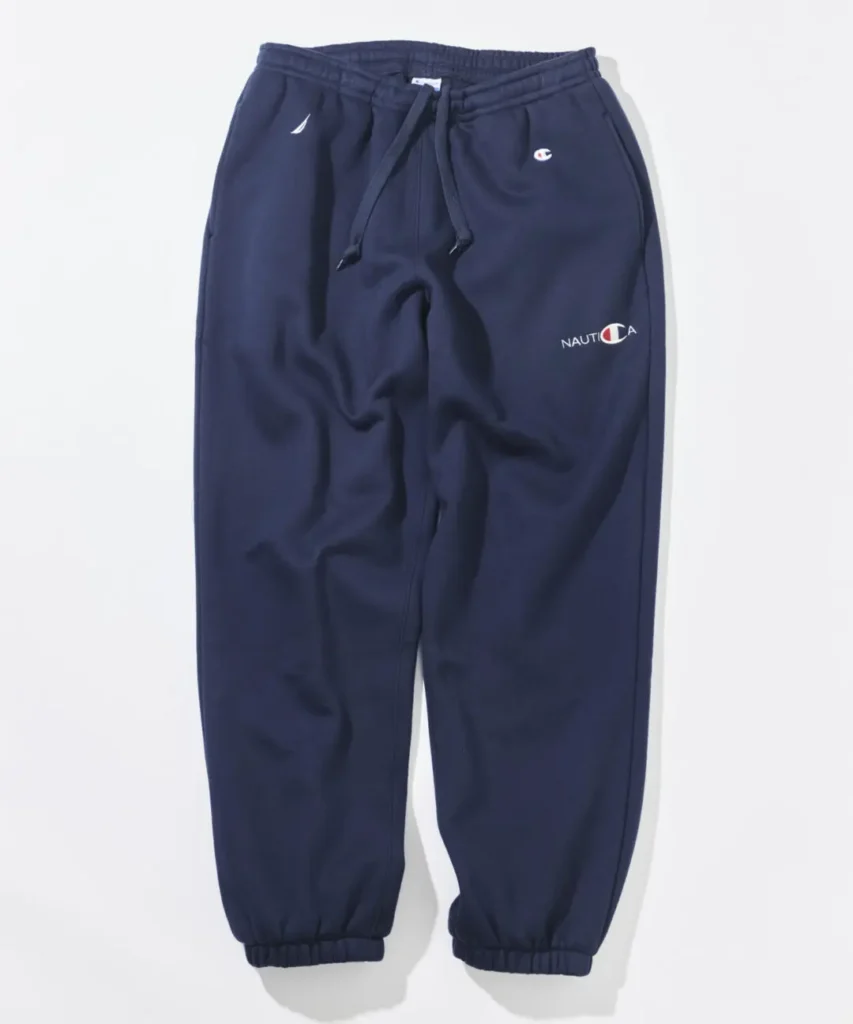 Navy Champion x Nautica sweatpant feature a drawstring waist, elastic cuff, Nautica brand and Champion logo detail