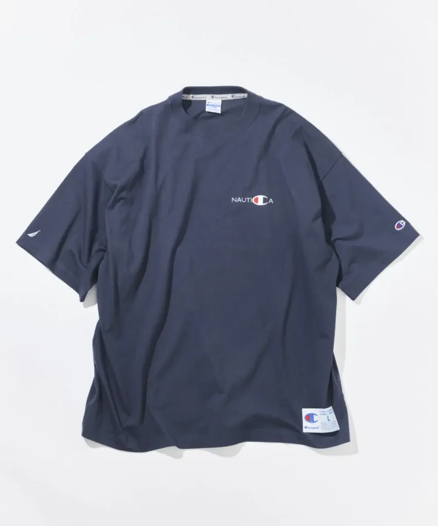 Navy Champion x Nautica oversized Tee feature embroider Nautica chest brand, Champion sleeve detail, and collide hem label