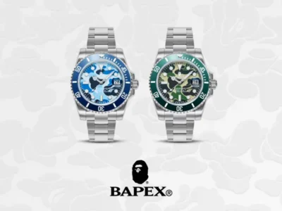 Two stainless steel BAPEX watches with blue and green camouflage dials display side by side above the BAPEX logo