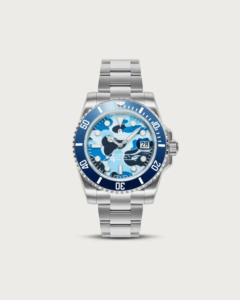 Front view of the blue BAPEX watch with a blue camouflage dial and polished stainless steel bracelet