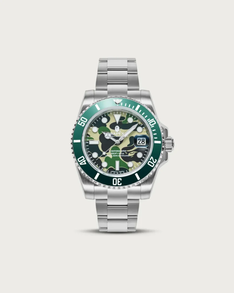 Front view of the green BAPEX watch featuring a green camouflage dial, matching bezel, and stainless steel bracelet