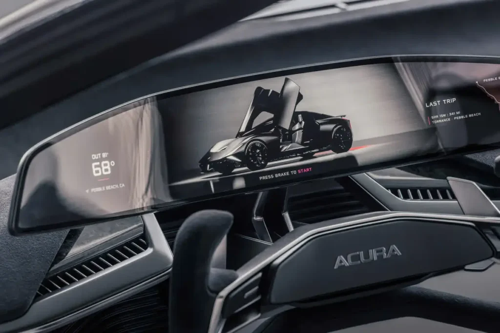 Acura NEXERA Vision cockpit feature a wide digital dashboard display, futuristic steer controls, navigation information, and a render view of the vehicle