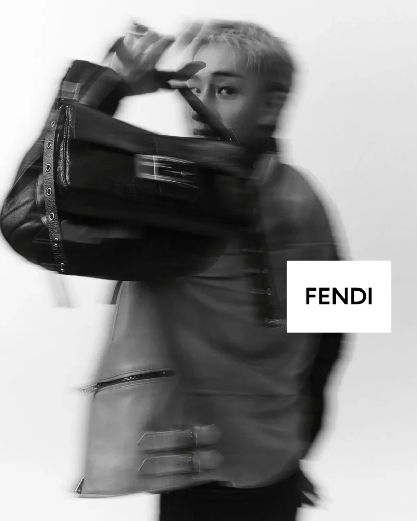 Black-And-White Fendi Portrait With Model Holdi A Large Leather Baguette Bag