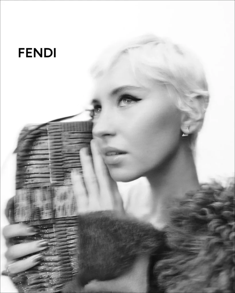 Black-And-White Fendi Close-Up With Woman Hold A Textured Baguette Bag