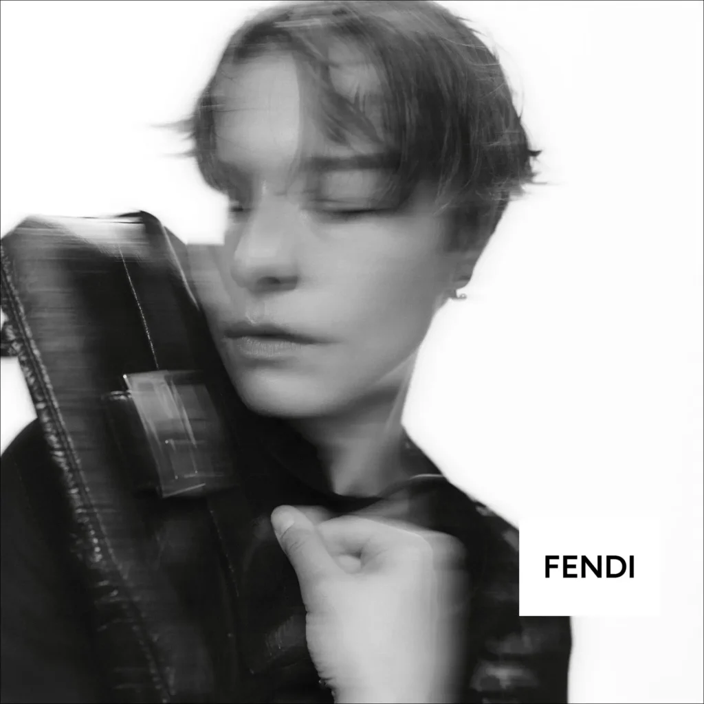 Black-And-White Fendi Close-Up With Model Hold A Leather Baguette Bag