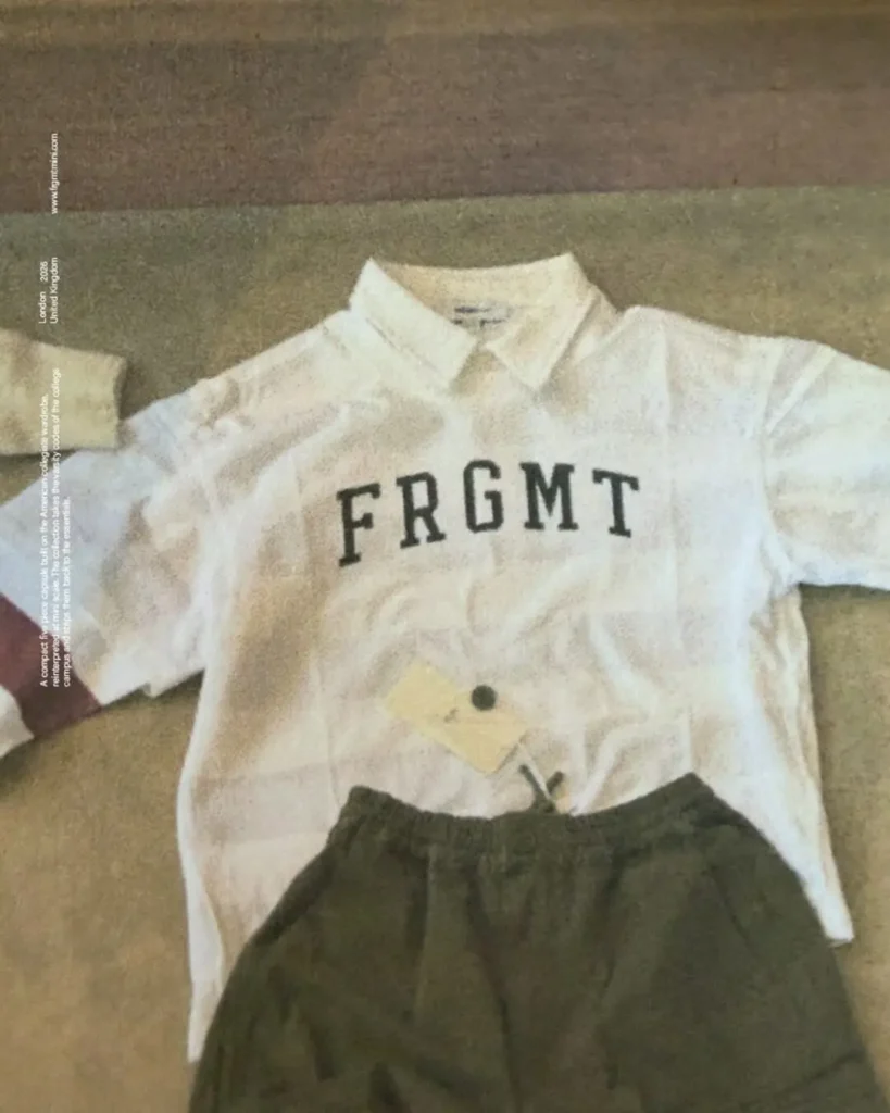 White FRGMT collared shirt and olive drawstring pants laid on beige carpet with London 2026 text