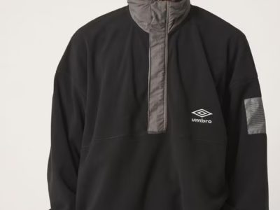 Model Wear Black Umbro Pullover With Gray High Collar And Chest Logo