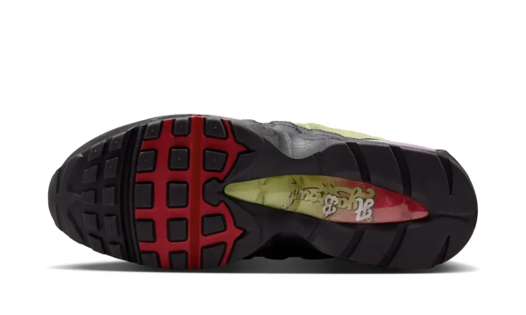 Bottom view of the A Ma Maniére x Nike Air Max 95 show a black and red rubber outsole with show graphic beneath the midfoot