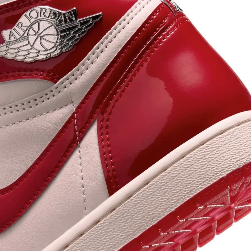 Close-Up Of White Laces And Red Patent Leather Panel