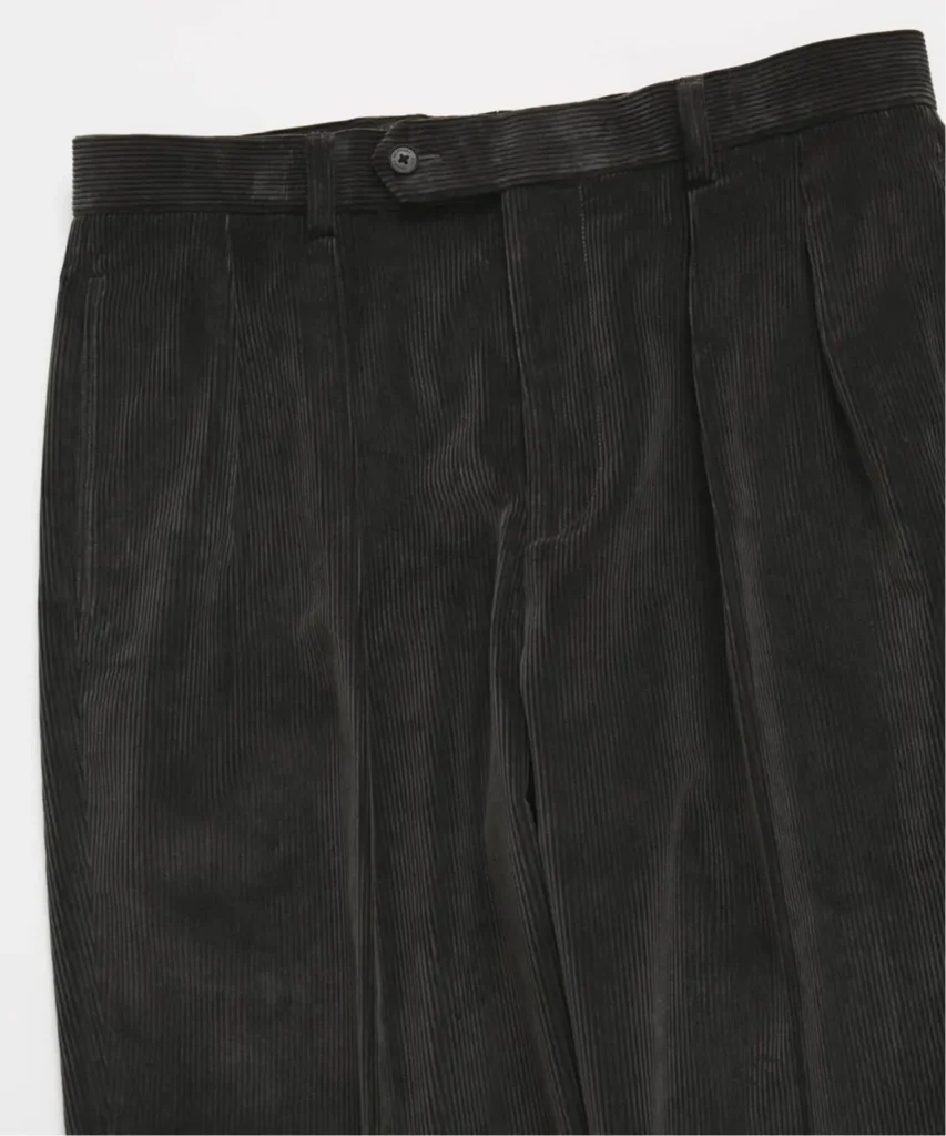 Close-Up Of Brooks Brothers Black Corduroy Trousers Show The Waistband, Belt Loops And Double Pleat