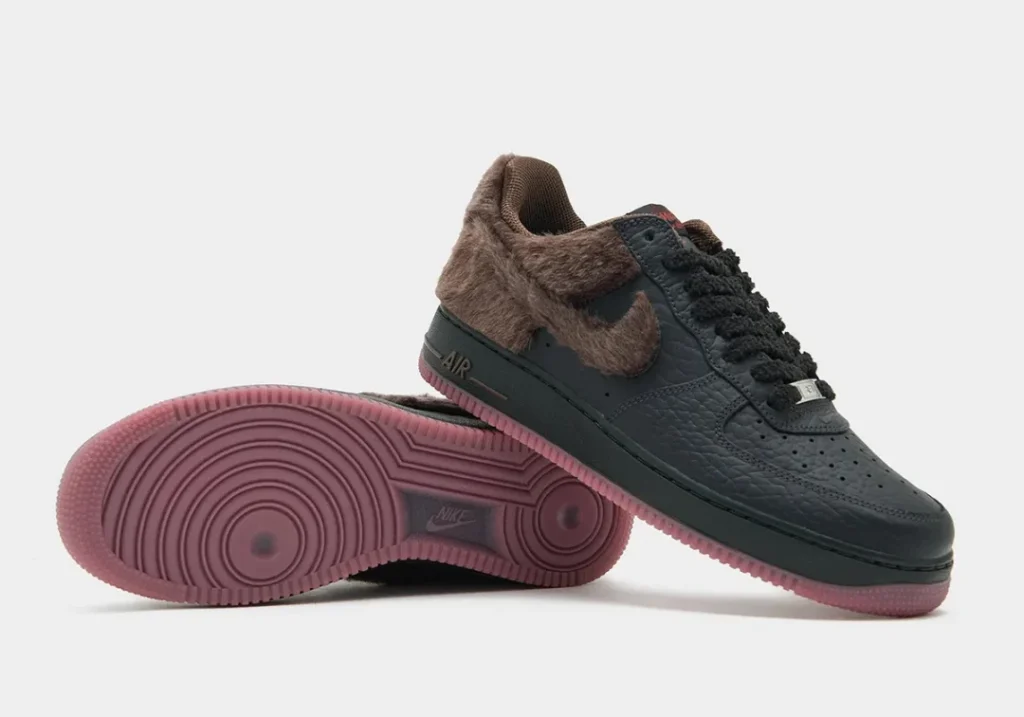 Black Nike shoe with brown faux-fur collar and swoosh, shown stack with one sole face forward