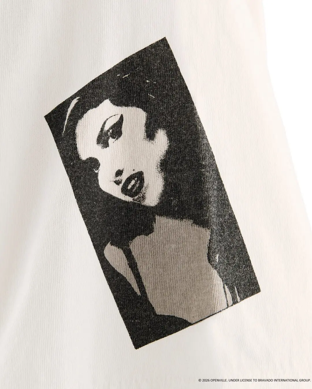 Close-Up Of White Fabric Featuring A Distressed Black-And-White Amy Winehouse Portrait Print.