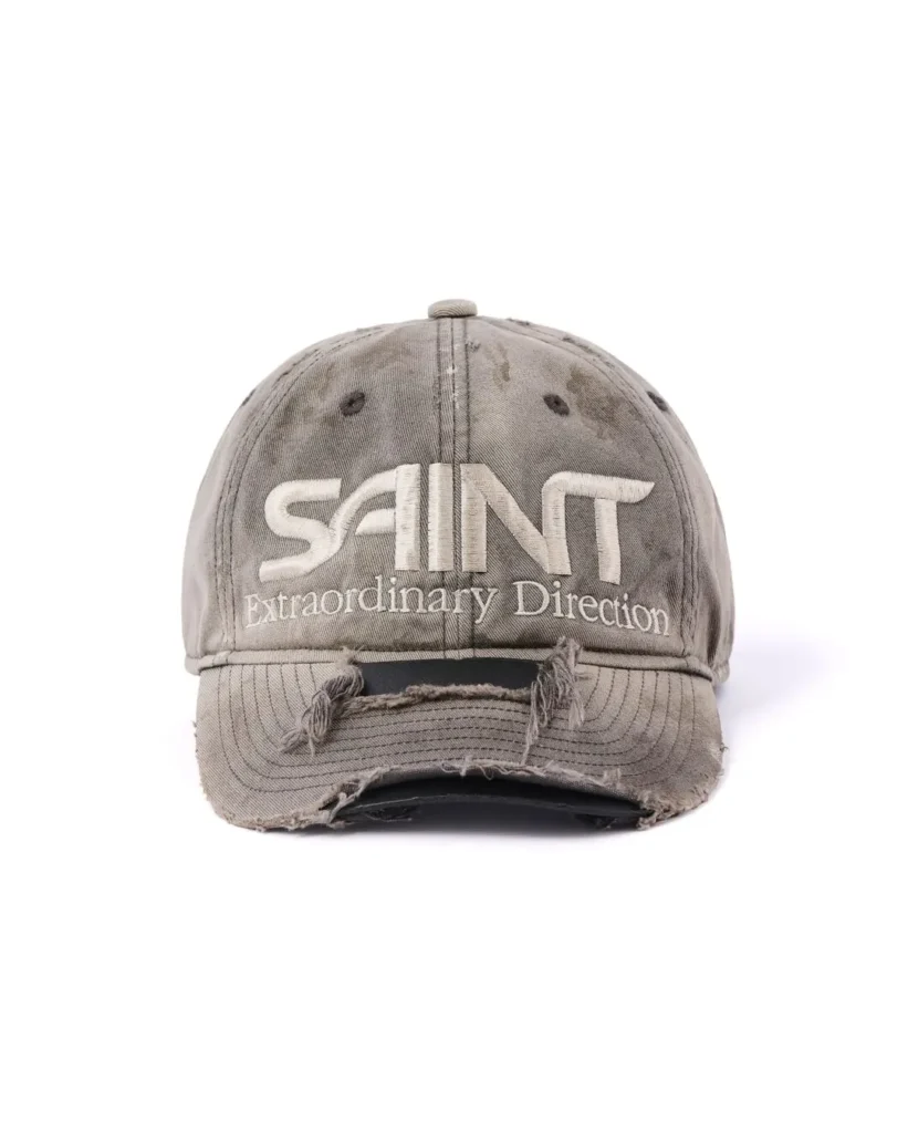 Distress Gray SAINT Baseball Cap Feature White “SAINT Extraordinary Direction” Embroider And A Fray Cutout Brim