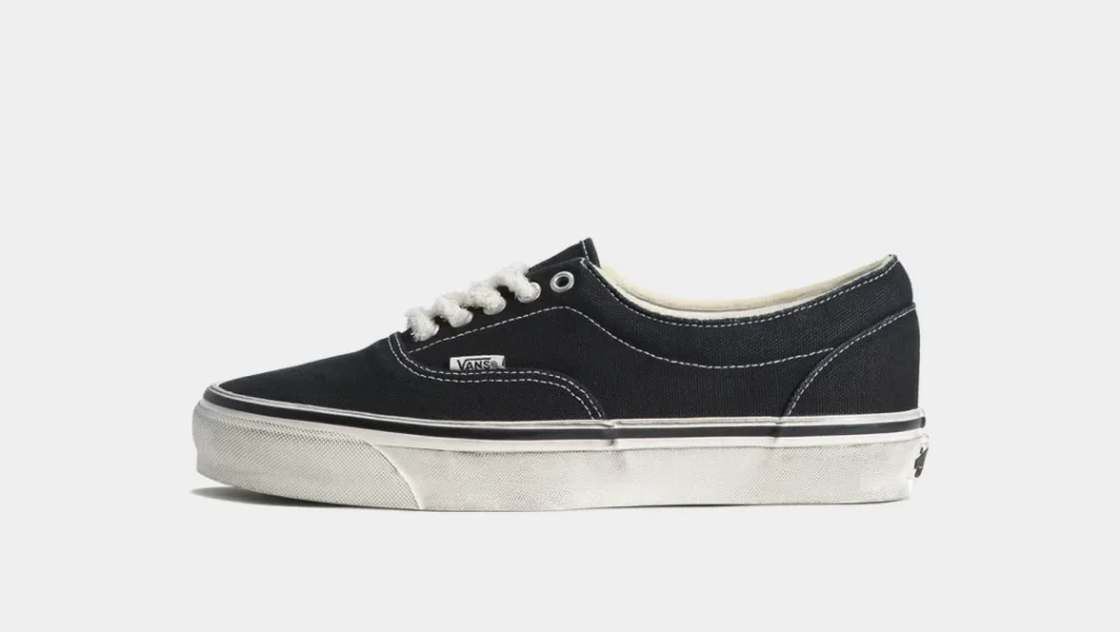 Black Canvas Vans Low-Top Shoe With White Stitch