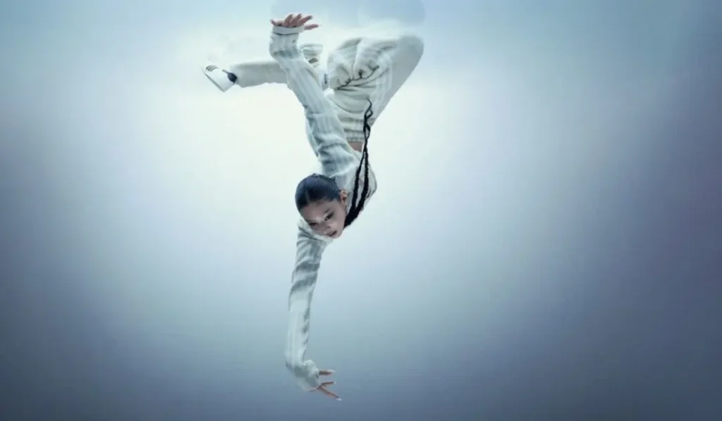 Model Performs An Inverted Dynamic Pose In A White Outfit And Adidas Jennie Ballet Shoe
