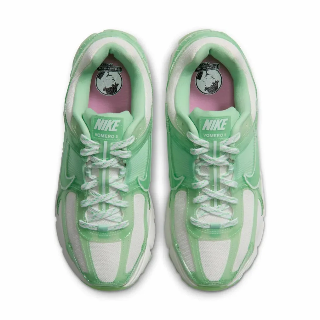 Overhead view of the pair showiwhite mesh toe boxes, mint tongue labels, green-and-white speckle laces, and pink insoles with Bowerman graphic