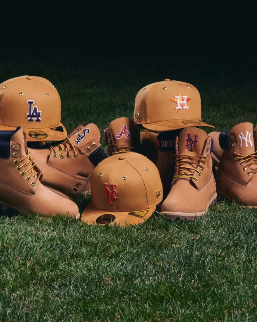 Close-up of tan MLB boots and fitted caps featuring the Dodgers, Astros, Mets, Yankees, White Sox and Braves