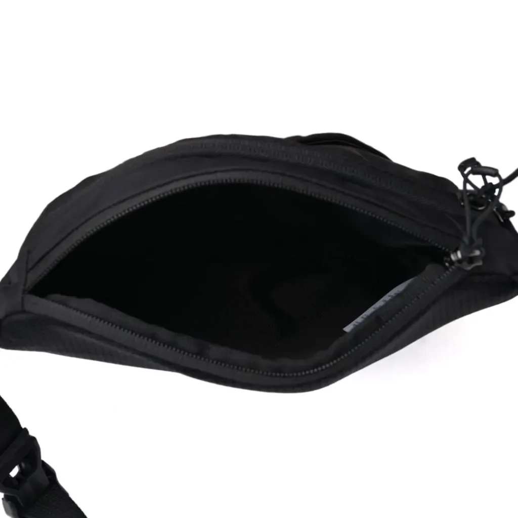 Open top view of the shoulder bag displaying the spacious main compartment, smooth zipper opening, and uncluttered interior layout