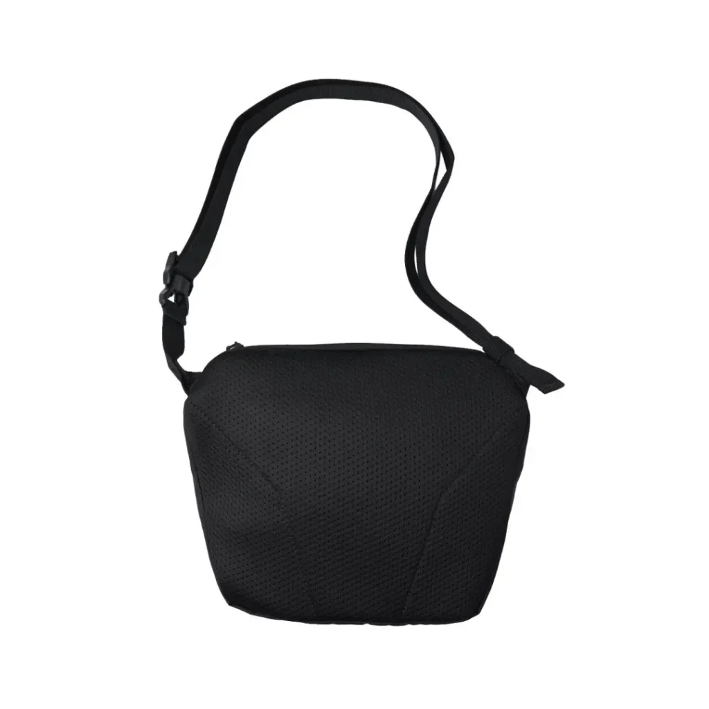 Back view of the black Salomon shoulder bag highlighting the breathable padded mesh panel, quilted construction, and clean minimalist sil