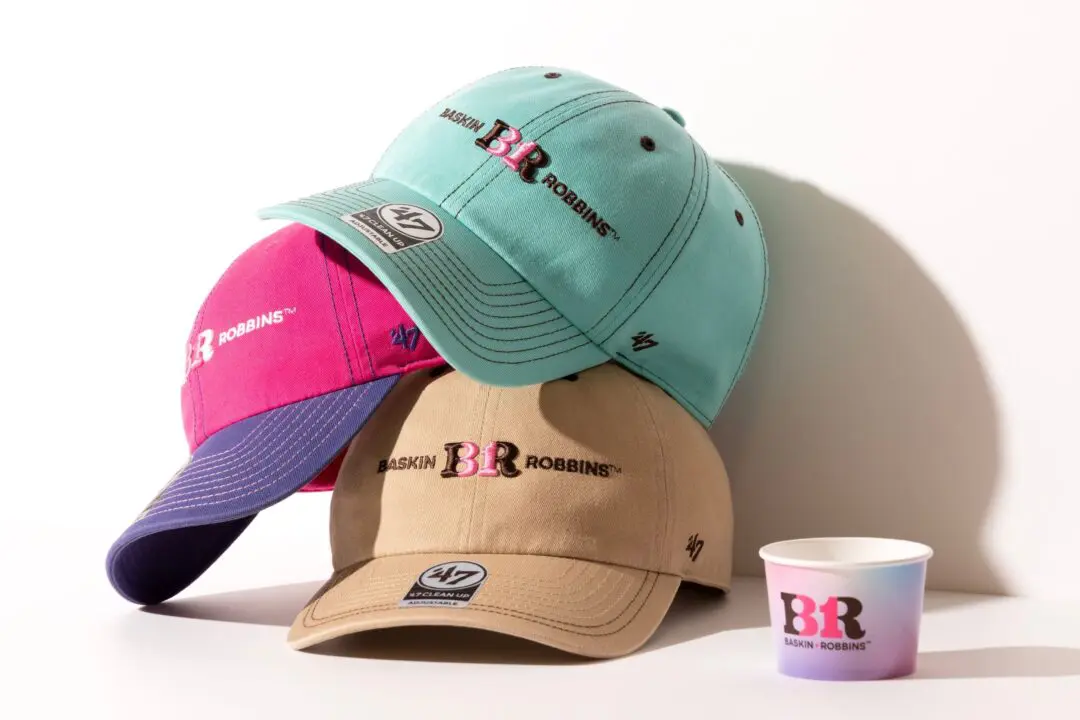 Three Baskin-Robbins x ’47 caps in mint, pink-purple, and tan stacked beside a branded ice cream cup.