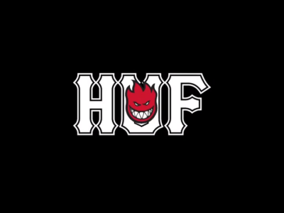 Group portrait featuring HUF x Spitfire apparel, including hoodies, sweatshirts, caps, and jackets in a relaxed indoor set