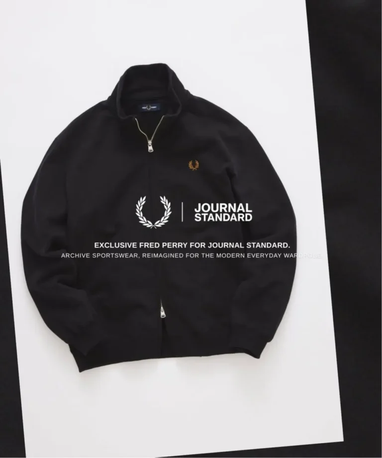 Black Fred Perry zip-up track jacket with gold Laurel Wreath embroidery, presented with JOURNAL STANDARD collide brand