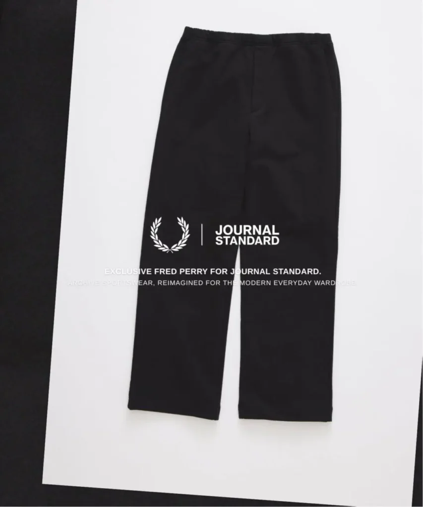 Black Fred Perry straight-leg trousers displayed on a white background with JOURNAL STANDARD collide brand