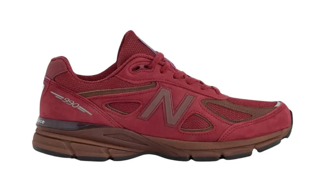 Burgundy New Balance 990v4 sneaker with brown midsole and black outsole on a white background