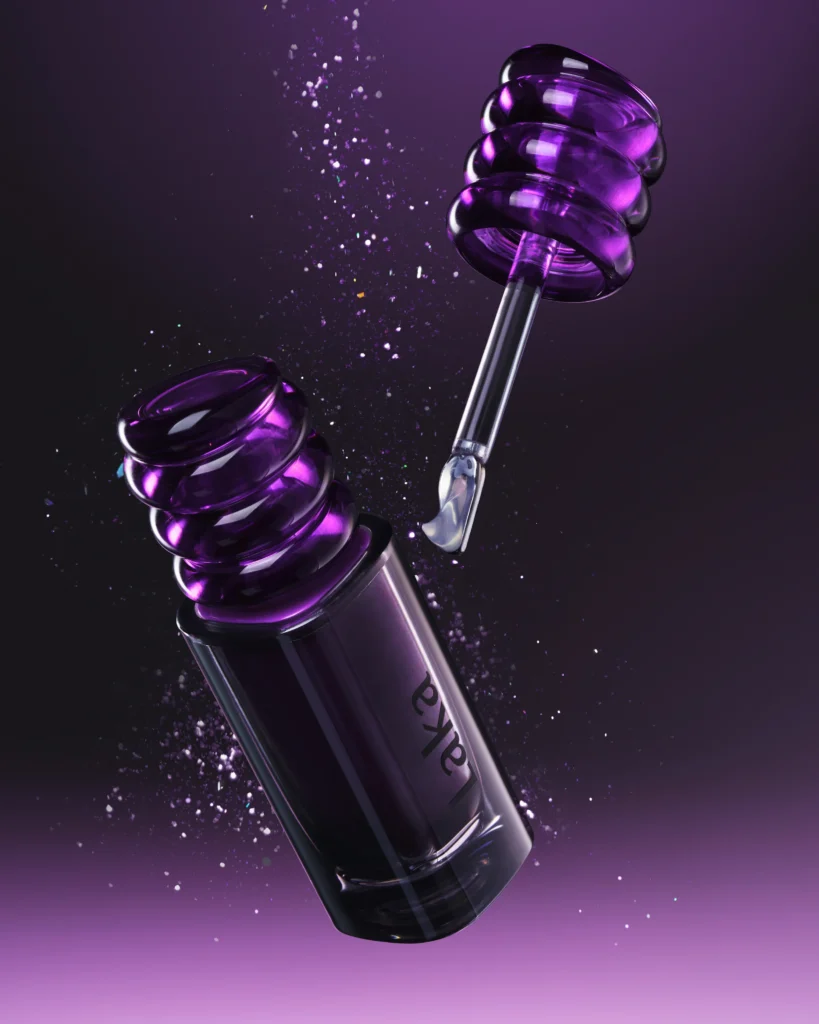 Laka purple lip product and clear gloss applicator suspended diagonally amid sparkling particles against a dark violet background