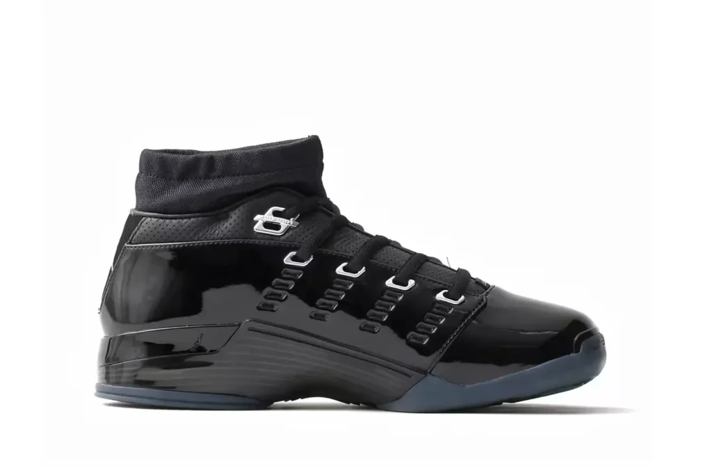 Side profile of a glossy black Jordan high-top with silver lace hardware and dark translucent outsole