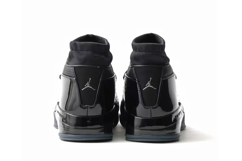 Rear view of black Jordan high-tops featuring silver Jumpman logo on the heel