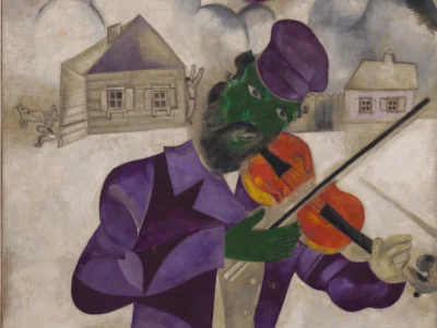 A Violinist In A Purple Suit And Cap Plays An Orange Violin Against A Dreamlike Village Landscape, With Small Houses, Figures, And A Horse-Drawn Cart In The Background