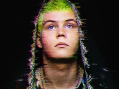 Yung Lean in distorted portrait with neon green hair, upward gaze, dark ornate hood and chain necklace against a black background, treated with heavy RGB color separation, horizontal glitch streaks, digital noise, scanlines and grain for a corrupted VHS-style effect