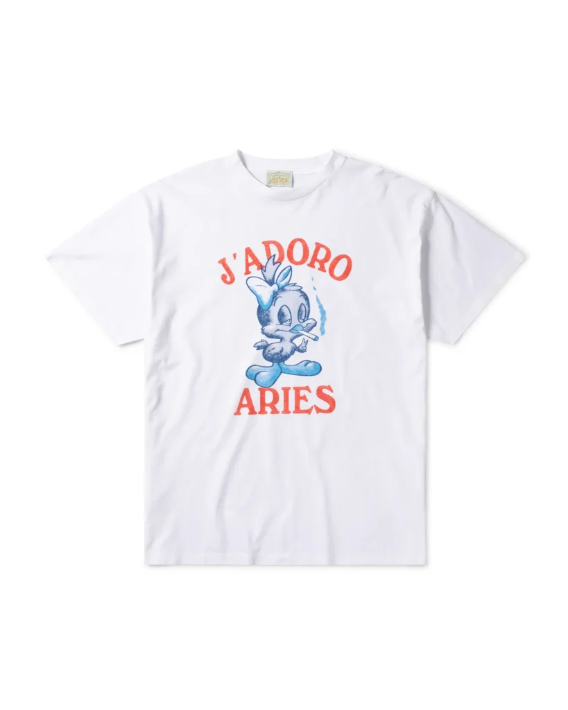 White Aries graphic Tee with a blue cartoon character, cigarette and red “J’Adoro Aries” letter