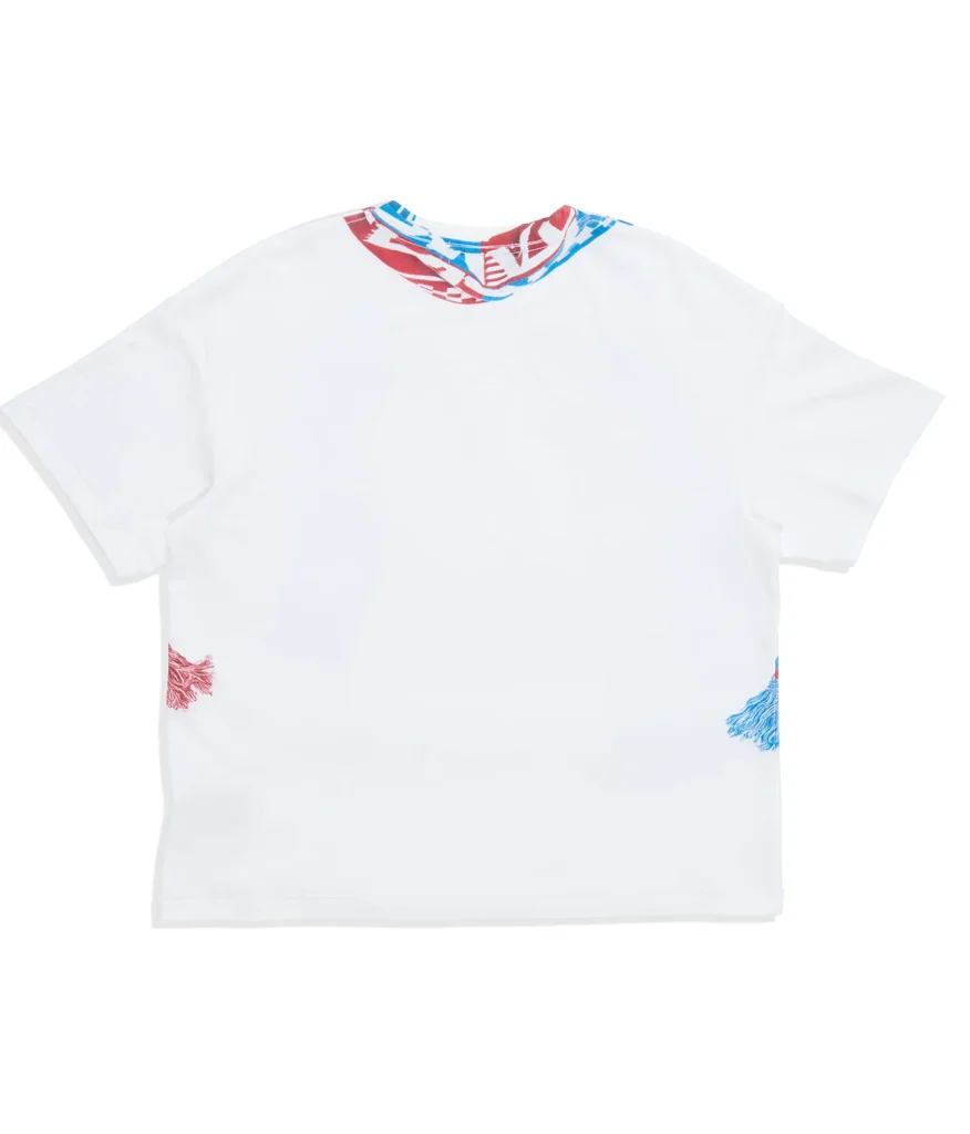 Rear view of the white oversized Tee with a clean back panel and continuation of the red-and-blue scarf print wrapping around the collar and side edge
