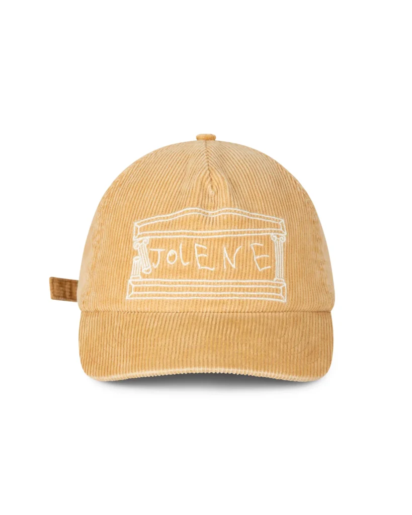 Tan corduroy cap with white embroider temple graphic and handwritten-style “Jolene” letter