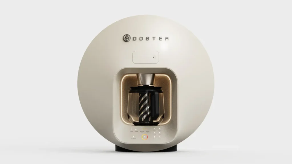 Cream DOSTEA beverage machine with rounded circular housing, illuminated brewing chamber, glass carafe, and integrated touch control