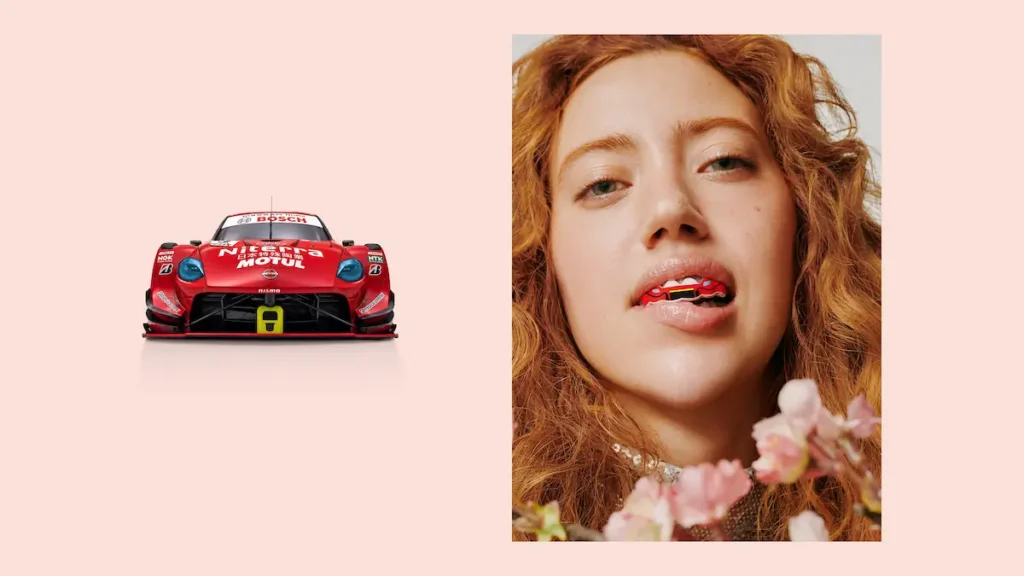 Red Nissan GT500 Race Car Beside A Red-Hair Model Wear A Match Grill