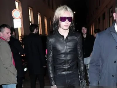 Nettspend Person With Two-Tone Hair, Purple Sunglasses And Black Leather Jacket Walk At Night
