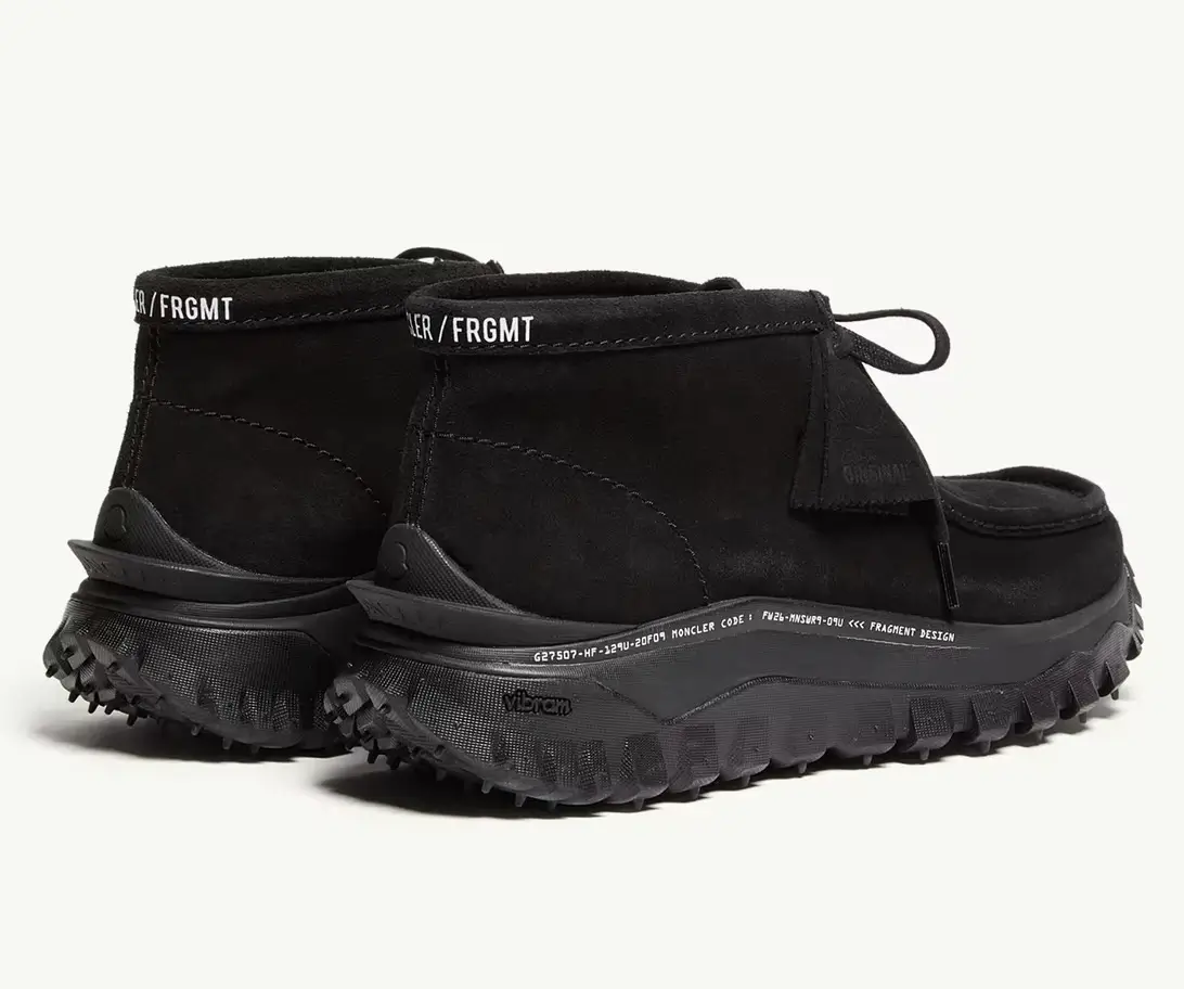 Black high-top Wallabee shoes with “FRGMT” branding and rugged lugged soles on a white background
