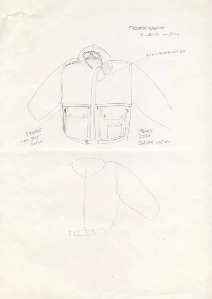Original C.P. Company design sketch of a hooded multi-pocket goggle jacket with handwritten construction note