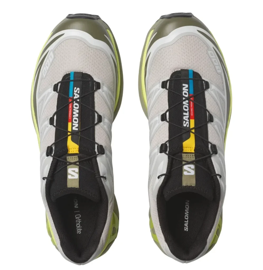 Top view of the Salomon XT-6 trail running shoes highlighting the Quicklace system, black tongue, and white mesh upper with multicolor lace accent