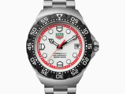 Front view of a TAG Heuer Formula 1 Solargraph watch with white dial, red accents, black rotating bezel and stainless-steel bracelet