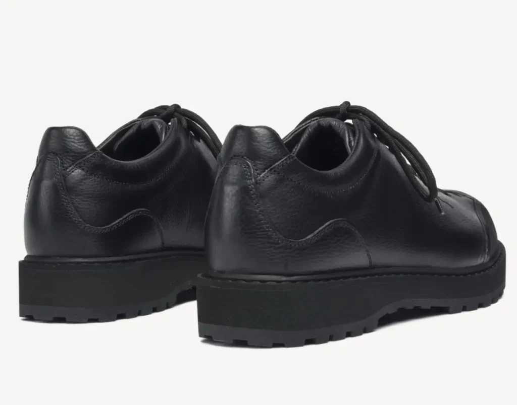 Rear View Of Black Leather Lace-Up Shoes With Lug Sole
