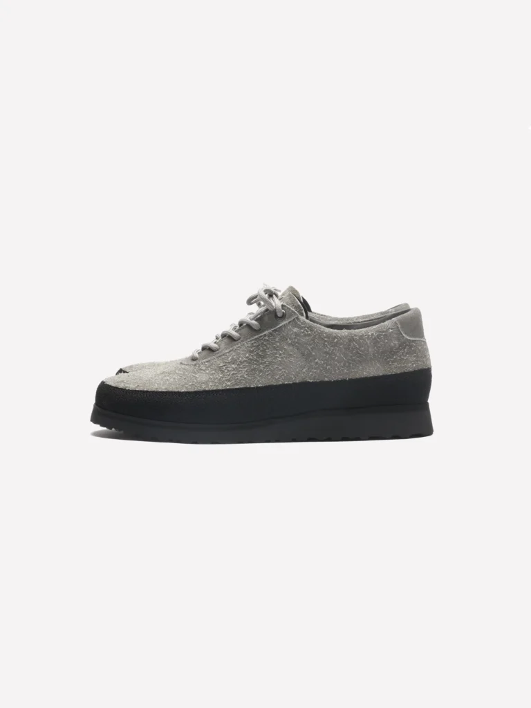 Mushroom gray hairy suede low-top shoe with tonal laces, black rubber rand, and a lightweight black outsole